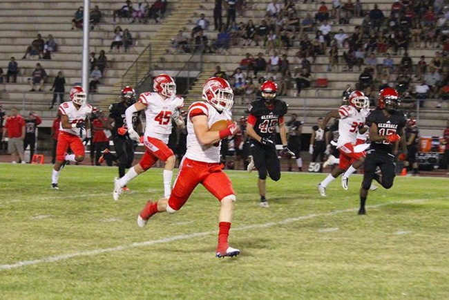 Trevor Russell sprints pass everyone on his way to a 76 yard punt return right before halftime Saturday night. (Photo by Aaron Webster)
