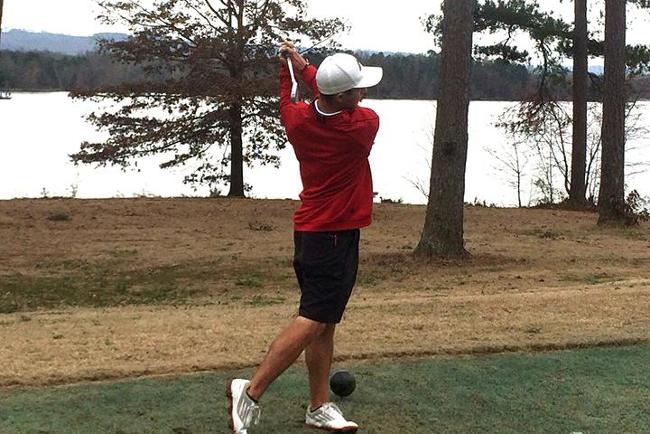 Brandon Carlson hits his tee shot on the fourth hole