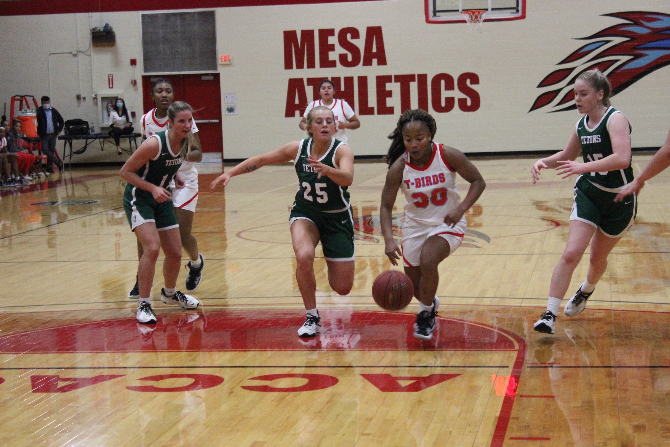 Mykah Anderson races by the Teton defense
